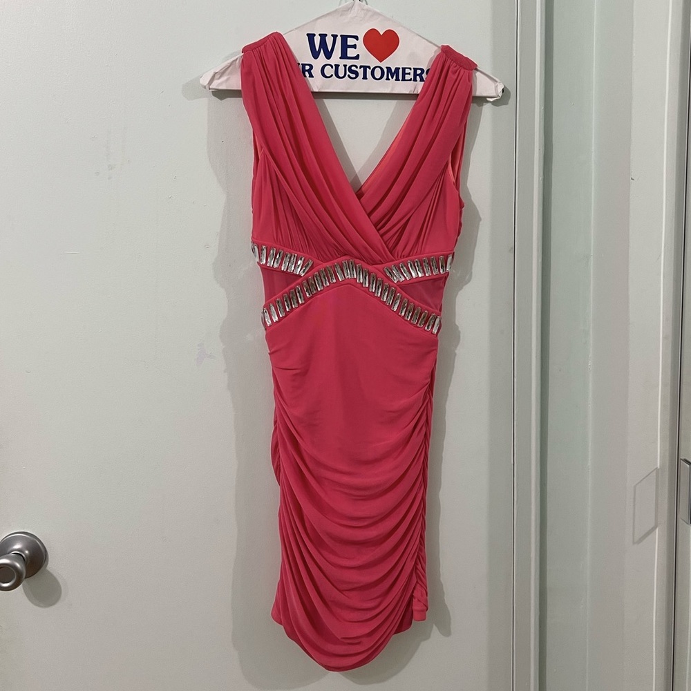 Hot pink bodycon dress with laced cutout sides